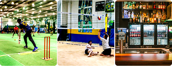Indoor beach volleyball players during a rally