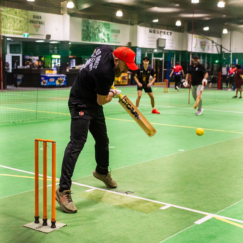 Cricket players in an indoor training session