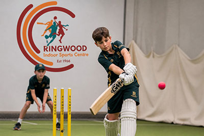 Junior cricket player batting at the wickets